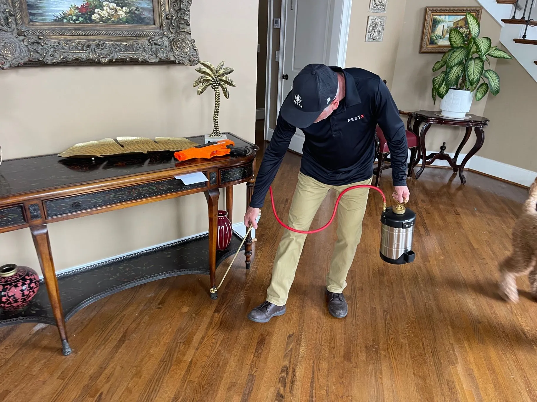 Scott Gilbert applying an interior pest treatment in a Jefferson County, Alabama home.